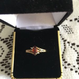 Rings 10k size 8.5 or 9 with garnet